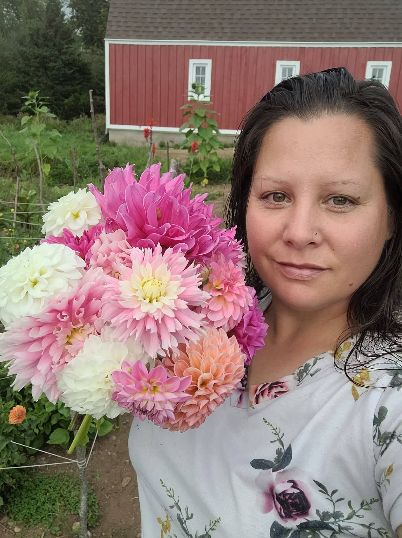 Kari Rouse with pink and white bouquet of dahlias